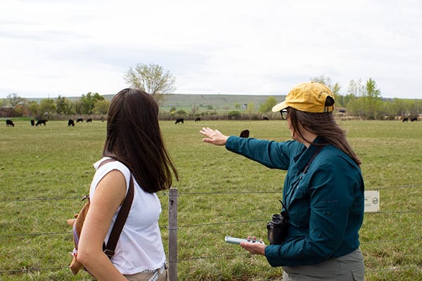 Two women looking at at a pasture