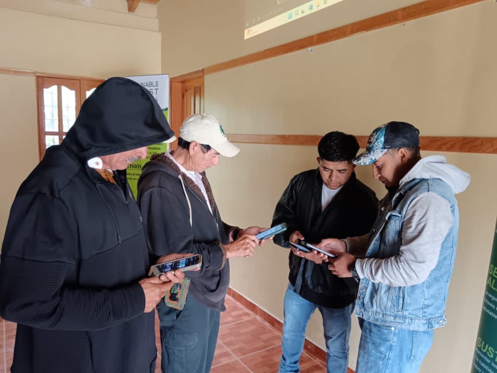 A group of people install an app on their phones